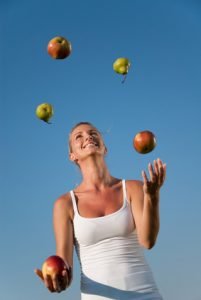 Woman Juggling Fruit
